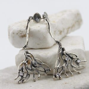 Silver earrings shaped like coral branches with cubic zirconia