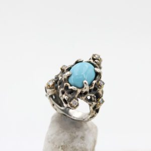 Silver and gold ring with turquoise stone and grey diamonds